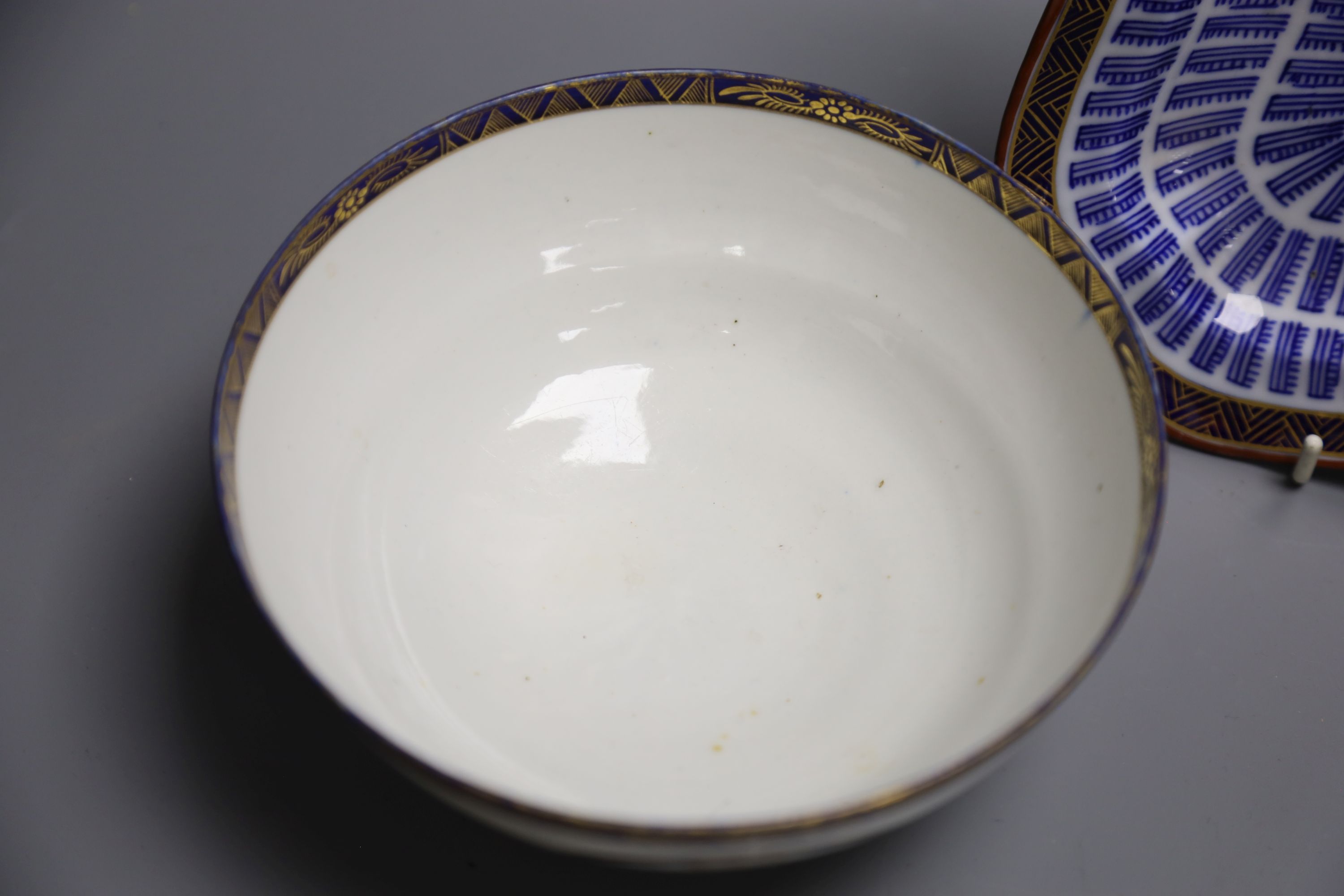 An 18th century Worcester square shaped dish with the Music pattern, 24cm, and a Worcester Flight period bowl